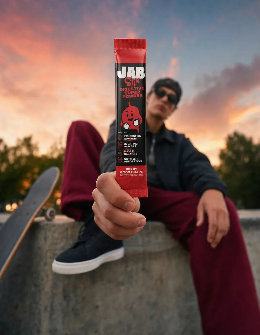 A skater holding up a JAB Stix